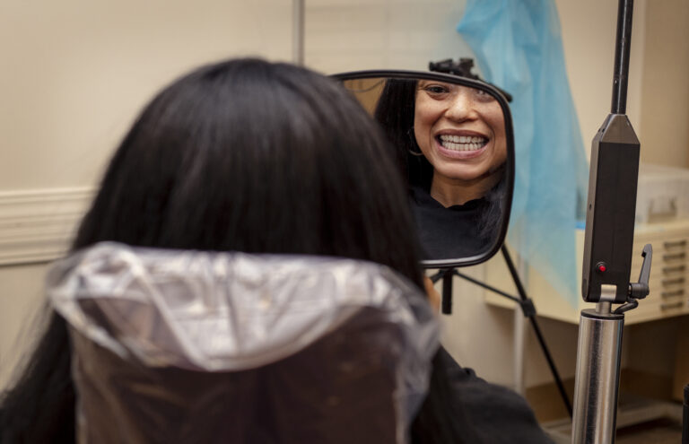 Patient looking at her smile with her orthodontist in Grove City, Ohio