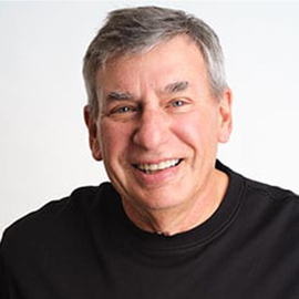 Seasoned Ohio Orthodontist Dr. Ron Carmen with a warm smile in a black tee shirt