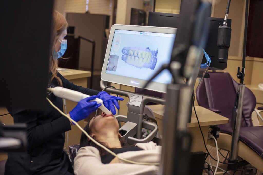 Patient laying down and having their bite scanned at Carmen Orthodontics in Ohio