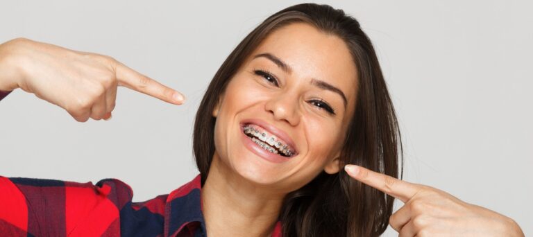 Face of a young woman with braces on her teeth